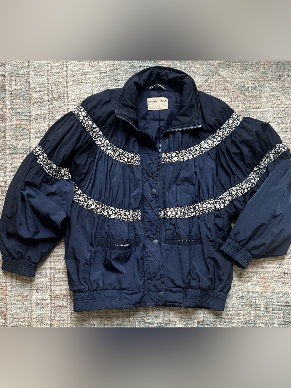 We The Free People “on my mind” navy floral accent S Lightweight Bomber Jacket